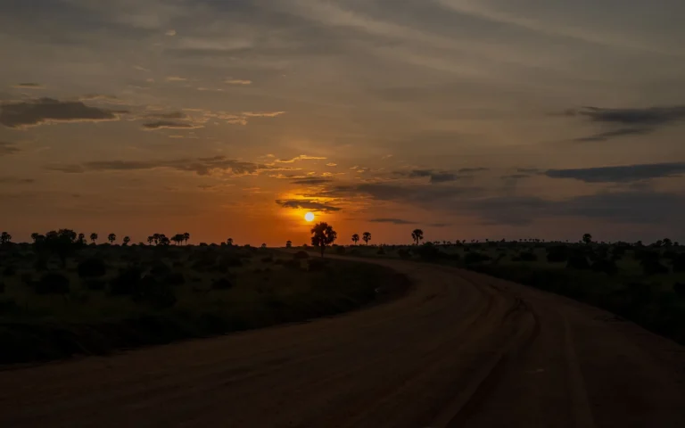 Sun setting over a track in Murchison Falls National Park