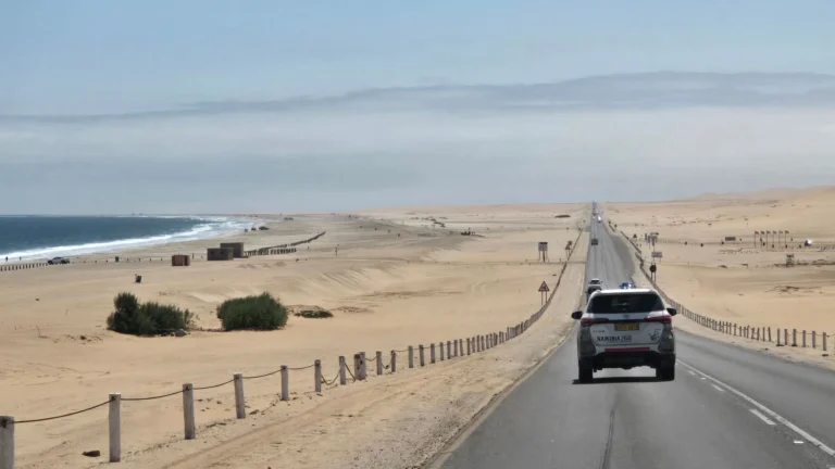 A coastal road between desert and ocean in Namibia