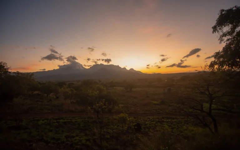 Sunset behind mountains in Pian Upe Wildlife Reserve