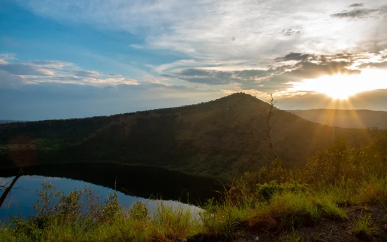 Sun setting over a crater rim in Queen Elizabeth National Park