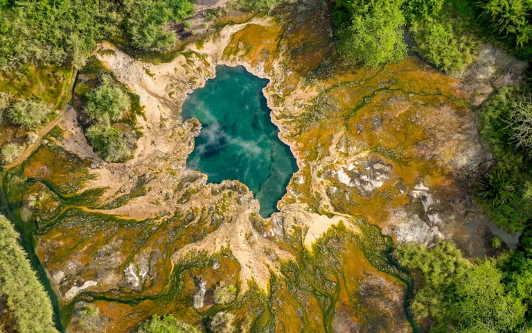 Aerial view of a turquoise hot spring in Semuliki National Park